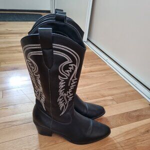 Black cowboy boots with white stitching